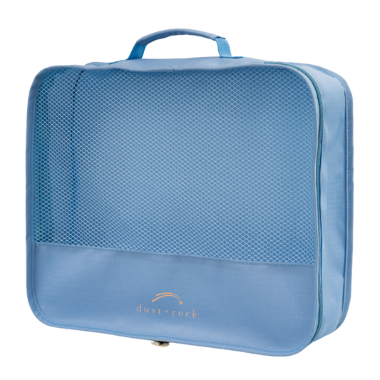 Sky blue packing cube made from recycled PET bottles, designed to maximise luggage space and keep travel essentials organised