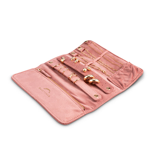 Dust and Rock Jewellery Wrap – pink foldable jewellery organiser shown open with storage for necklaces, rings, bracelets, and earrings; includes zip pocket, ring bar, snap closures, and soft lining. The perfect compact travel jewellery case or home organiser.
