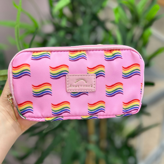 Dust and Rock Original Wrist Pocket – 'Pride' edition in pink with vibrant rainbow flag print; a bold, hands-free accessory perfect for Pride events, festivals, travel, and everyday wear with style and purpose.