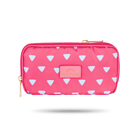 Dust and Rock Original Wrist Pocket in pink with blue triangle print – compact, stylish, and hands-free wallet designed for convenience and travel.