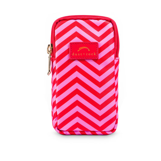 Dust and Rock Mini Wrist Pocket – 'Sunset With You' edition with bold red and pink chevron print and matching red trim; a compact, hands-free wrist pouch for carrying a smaller phone, keys, and daily essentials in vibrant style.